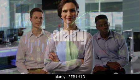 Standing center female professional wearing blouse crossing arms in modern office, projected charts Stock Photo
