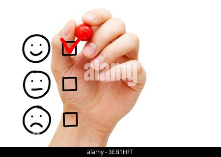 Happy client putting check mark on blank excellent customer service evaluation survey form. Customer satisfaction and retention concept. Stock Photo