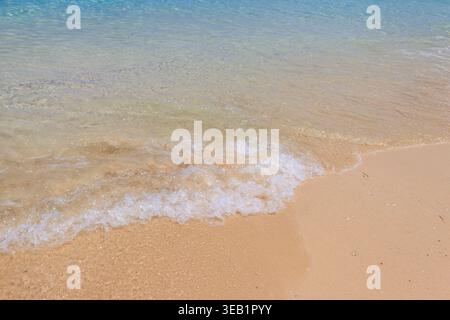 Soft wave of ocean on sandy beach Stock Photo