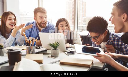 Multiethnic friends having fun, studying together for exams Stock Photo