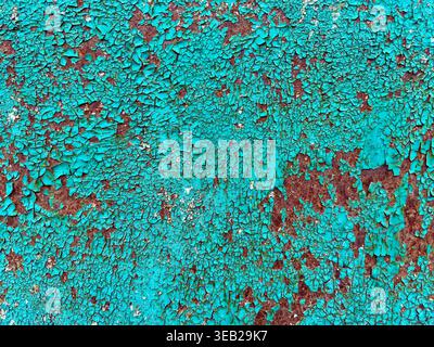 Grain texture. Cracked turquoise paint with rust patches, rugged texture close-up. Stock Photo