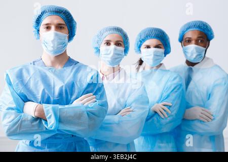 Surgeons Team Ready for Surgery. Practitioners Wearing Protective Uniforms Stock Photo