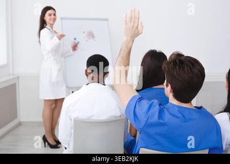 Medical Doctor Giving Lecture, Active Intern Having Question Stock Photo