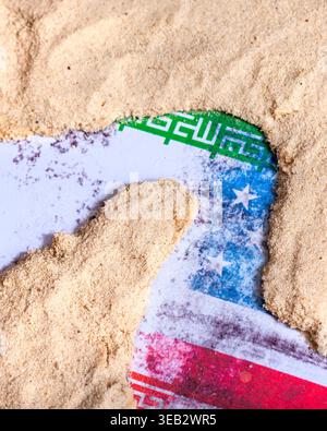 Conceptual image showing global flags partially buried under sand, representing how disruptions in the Strait of Hormuz affect multiple nations. Highl Stock Photo