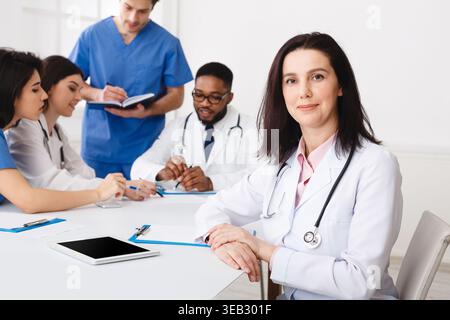 Medical Team Conference. Female Practitioner At Meeting Stock Photo