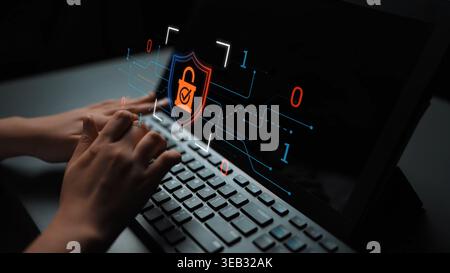 Close-up of Hands Typing on Keyboard with Digital Security Shield and Lock Icon Representing Cybersecurity and Data Protection Concept in Technology Stock Photo