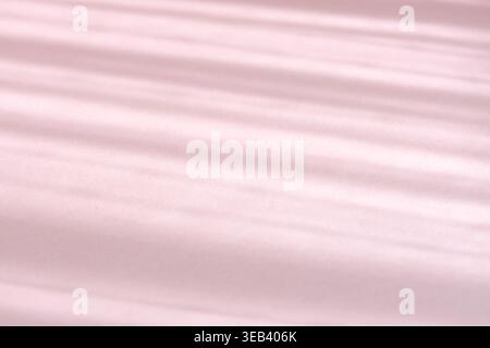 Abstract pink background showing sunbeams casting diagonal shadows and light stripes Stock Photo