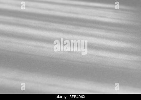 Abstract gray background showing sunbeams casting diagonal shadows and light stripes Stock Photo