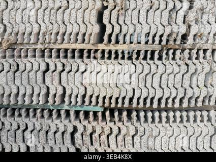 Old roof tiles arranged in rows, abstract background. Stock Photo