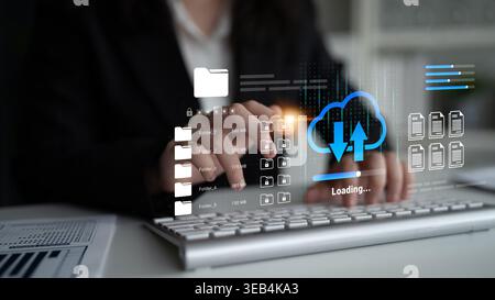 Businesswoman interacts with a digital cloud interface, showcasing file management and loading indicators. A modern representation of technology in Stock Photo