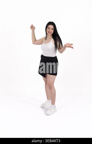 Happy woman celebrating with a success gesture Stock Photo