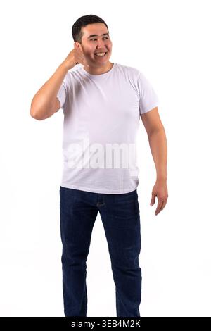 Young man standing and touching his head in thought Stock Photo