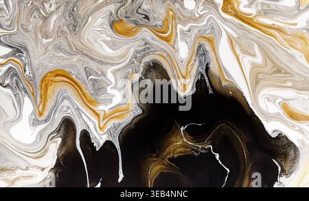 Fluid Art With Swirling Patterns of Gold and Silver on a Dark Background in Abstract Design Stock Photo