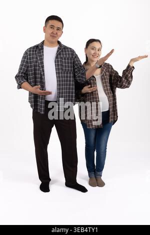 Couple posing together with a digital tablet in studio Stock Photo