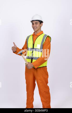 Worker in orange uniform showing thumb up Stock Photo