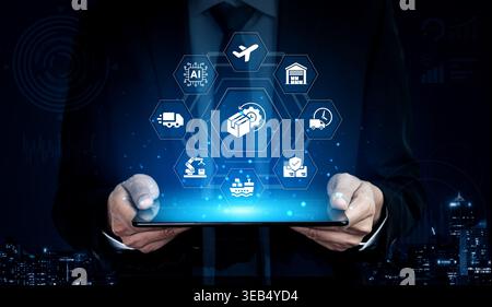 A businessman interacts with a tablet displaying modern logistics icons, symbolizing the integration of technology in supply chain management and Stock Photo