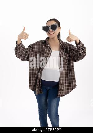 Man making thumbs up gesture with both hands while smiling Stock Photo