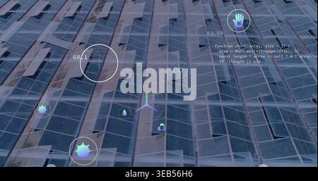 Displaying glass high-rise glazing at urban exterior, showing AR HUD icons readout code mesh Stock Photo
