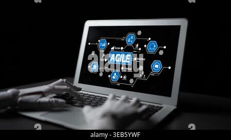 A robotic hand interacts with a laptop showcasing Agile methodologies, emphasizing project management strategies in a tech-driven workspace. Ideal for Stock Photo