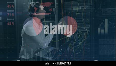 Inspecting tech in sweater in datacenter aisle, checking server rack with cables and overlays Stock Photo