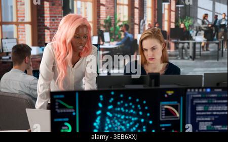 Programmer Leads Diverse Team Analyzing AI Training Data For Future Solutions. Stock Photo