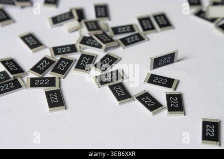 Surface mount resistors 222 scattered on white background Stock Photo