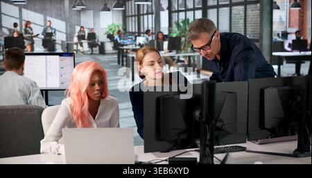 Manager Leads Diverse Team Training On Secure Document Management System. Stock Photo