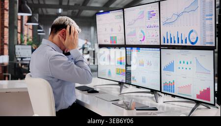 Stressed Business Analyst Struggles To Interpret Intricate Data On Screen Stock Photo