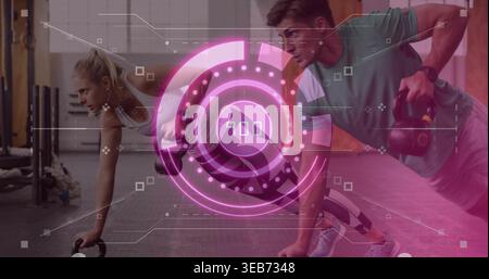 Holding kettlebells, duo doing plank rows on gym rubber floor with magenta HUD in athletic gear Stock Photo