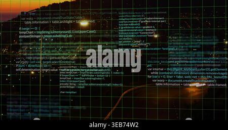Displaying green grid overlay with code text over coastal twilight, on water and shore lights Stock Photo