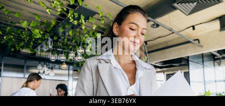 Licensed inspector analyzes environmental statistics using multiple tools Stock Photo