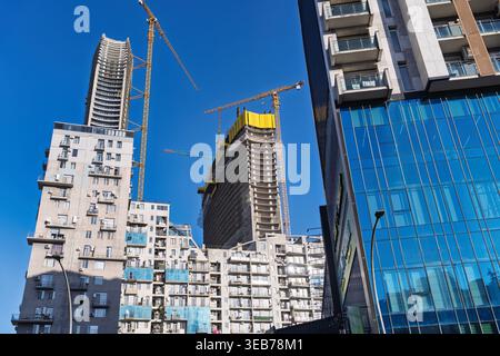 Batumi, georgia 21 april 2026: batumi, georgia urban development showing modern residential buildings with balconies and construction cranes against a Stock Photo