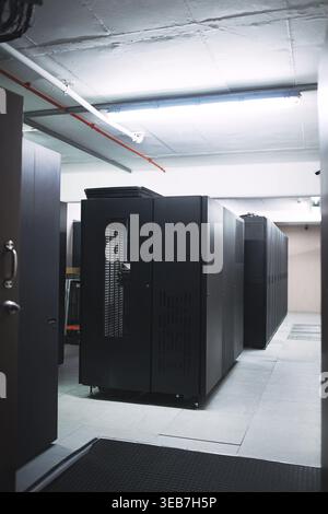 Interior, storage and servers in empty data center for cybersecurity, IT hardware and infrastructure. Mainframe, facility and database machine for Stock Photo