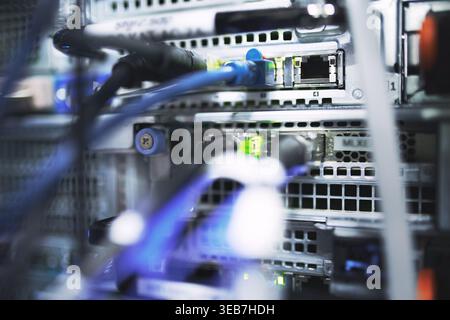 Closeup, rack and ethernet cables in server room for database, IT infrastructure and backup system. Dashboard, mainframe or optical panel with Stock Photo