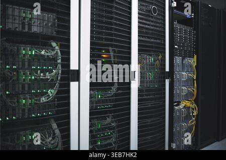 Storage, servers and mainframe in empty data center for cybersecurity, IT hardware and infrastructure. Interior, cables or database machine for power Stock Photo