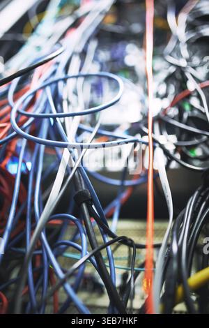 Closeup, rack and ethernet wire in server room for database, IT infrastructure and backup system. Hardware, mainframe and optical panel with Stock Photo