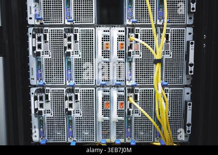 Storage, servers and cables in empty data center for cybersecurity, IT hardware and infrastructure. Mainframe, wires and database machine for power Stock Photo