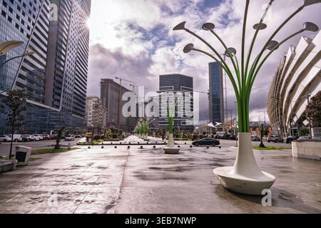 Batumi, georgia 21 april 2026: batumi, georgia cityscape featuring modern glass skyscrapers, streets, lamps and cranes reflecting growth and contempor Stock Photo