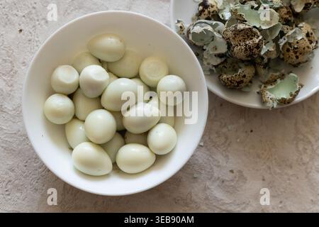 Boiled Quail Eggs in white bowl on table.  Stock Photo
