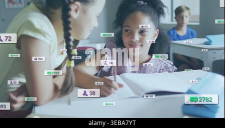 Smiling girl in purple top holding pencil over open notebook at school, with overlays, books Stock Photo