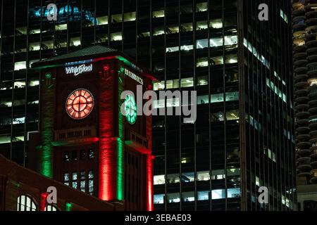 Chicago, Illinois, USA - November 27, 2023 - Clocktower of the Reid Murdoch building at night home of Whirlpool and Encyclopedia Britannica Stock Photo