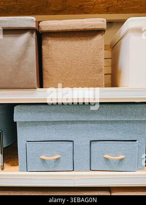 Valmiera, Latvia - April 22, 2026: Neatly arranged fabric storage boxes and drawers on a shelving unit, showcasing modern home organization, declutter Stock Photo