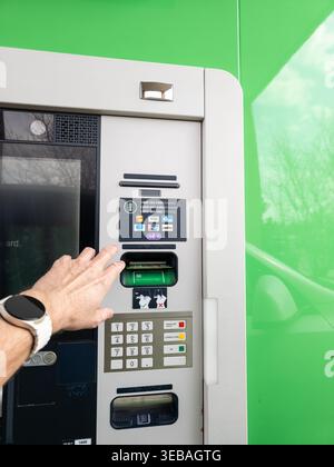 Modern digital banking interaction and secure ATM user experience. Stock Photo