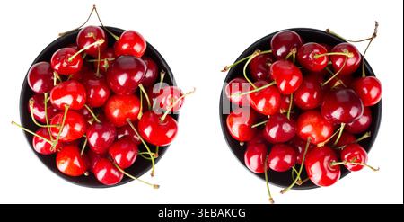 Top view of two dark bowls overflowing with fresh, juicy red cherries. High-quality macro image with vibrant colors and stems, isolated on white backg Stock Photo