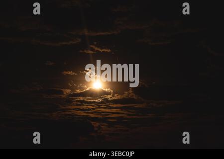 Dramatic evening sky. The sun is shining through the clouds. Stock Photo