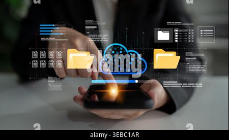 A business professional interacts with a smartphone interface showcasing cloud technology for efficient file management and secure data storage Stock Photo