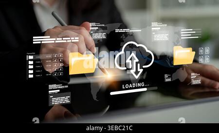 A business professional interacts with a digital interface depicting cloud technology, emphasizing online data uploading and downloading with a global Stock Photo