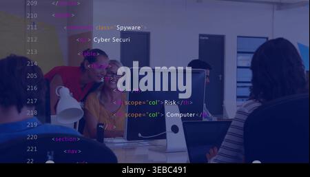 Working team in casual shirts leaning and typing at open office with central monitor code overlay Stock Photo