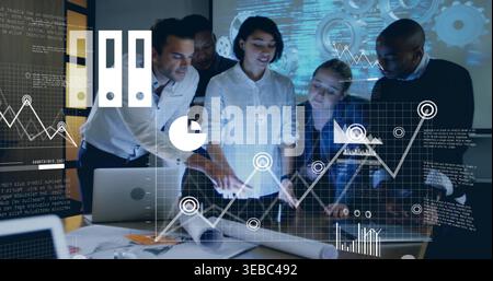 Analyzing team of five in work shirts using projected charts at meeting table, laptop printouts Stock Photo