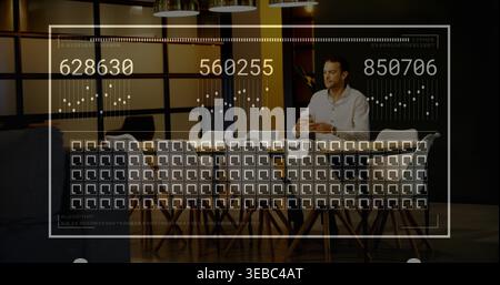 Sitting man in white shirt scrolling smartphone at conference table with HUD overlay, copy space Stock Photo